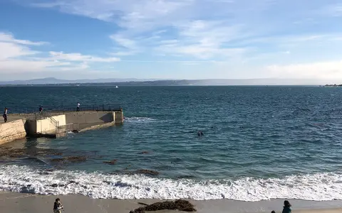 The sandy beach and calm cove at Lovers Point Park